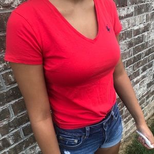 Red polo Ralph Lauren shirt.